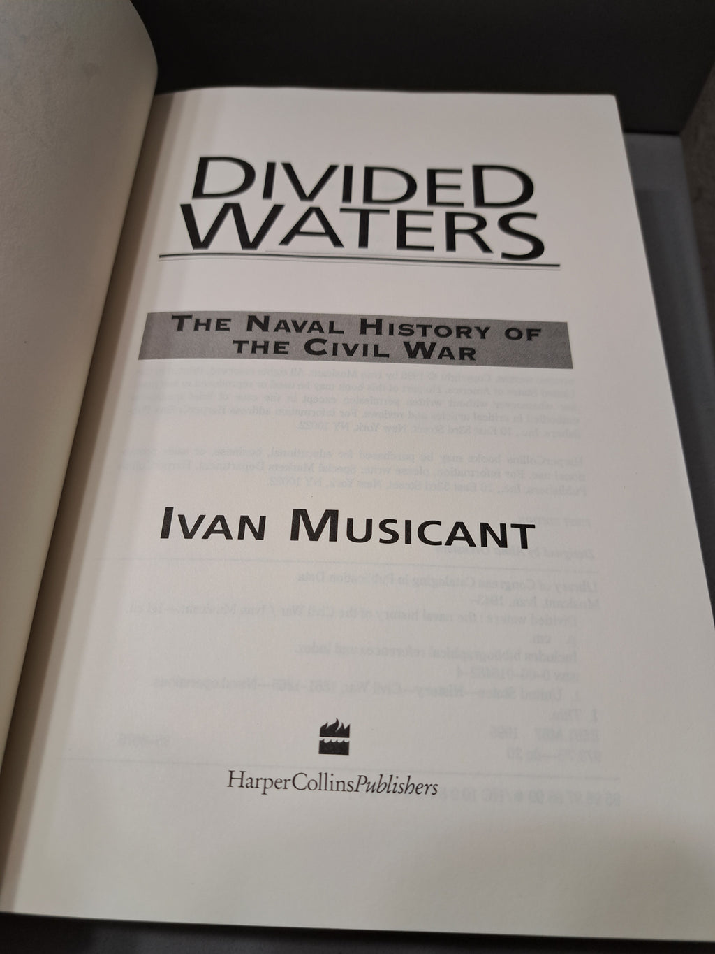 1995 first edition of Divided Waters: The Naval History of the Civil War by Ivan Musicant